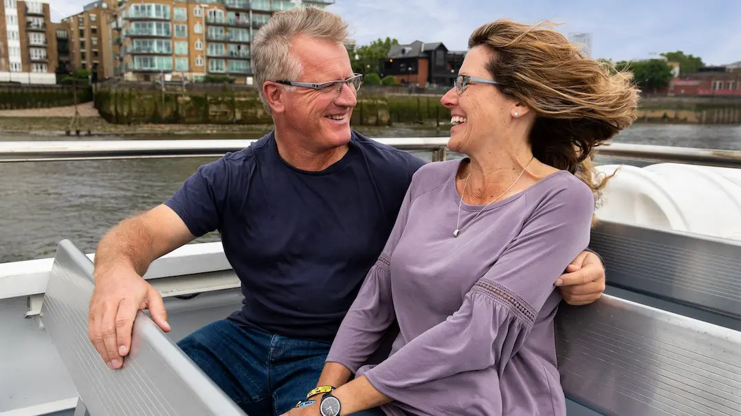 A couple enjoying a Thames River Sightseeing cruise