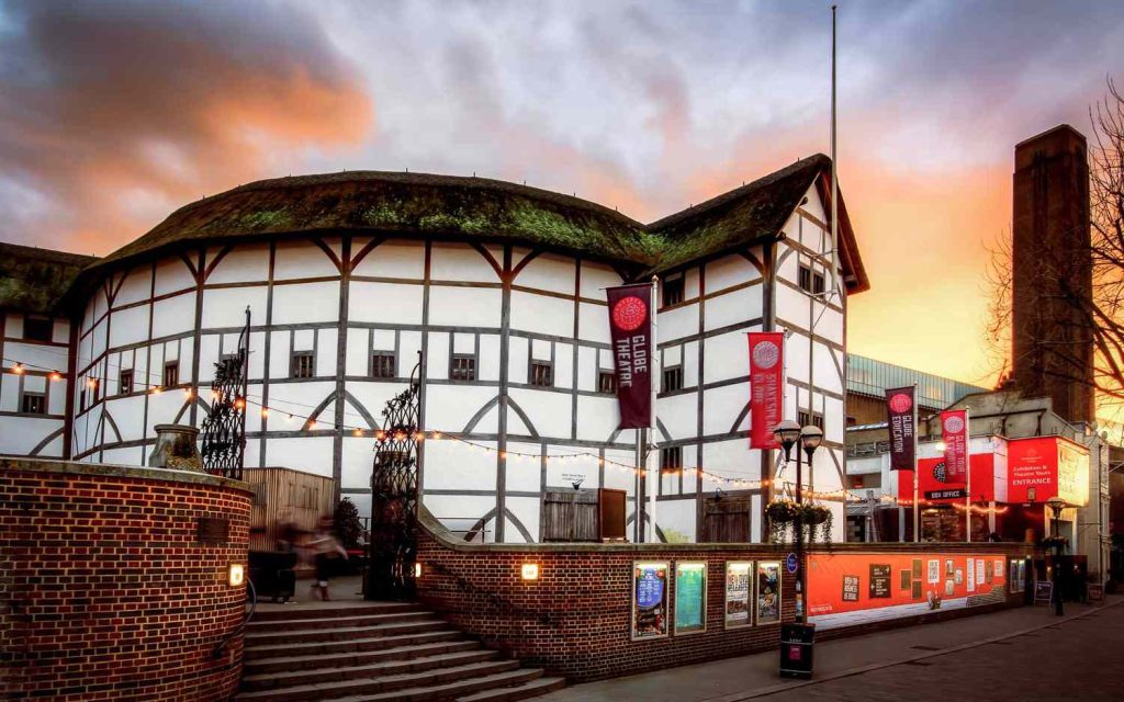 Vibrant scene at the Globe Theatre, London, in March 2020, featuring a live Shakespeare play