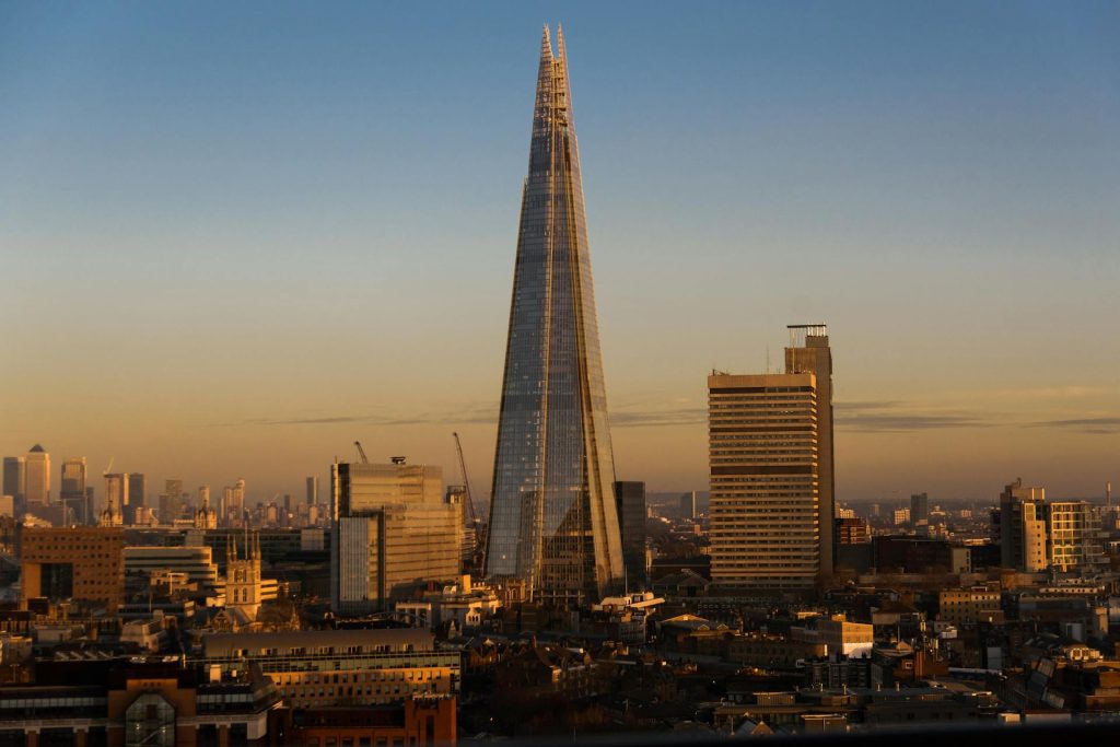 Majestic view of The Shard, London's iconic skyscraper, towering above the cityscape with Thames River Sightseeing