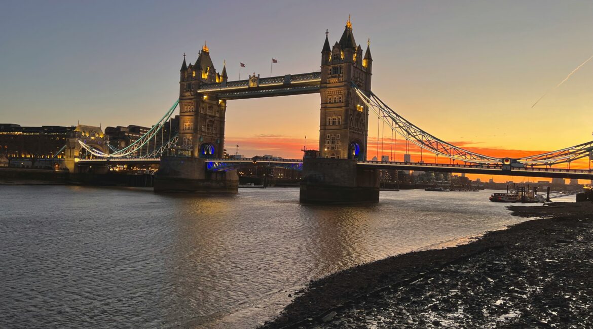 Tower Bridge illuminated at sunset over the River Thames, London