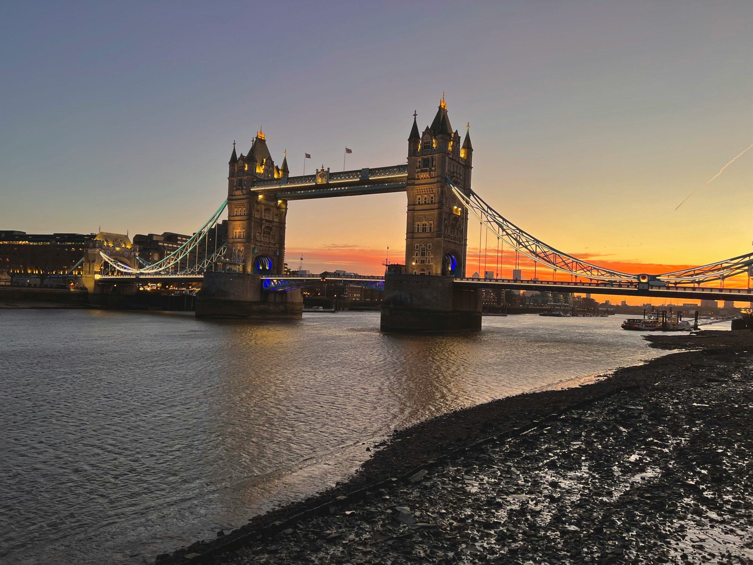 Tower Bridge illuminated at sunset over the River Thames, London