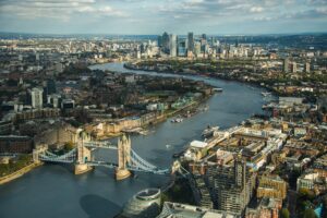 Aerial view of Tower Bridge and the River Thames with the Canary Wharf skyline in London