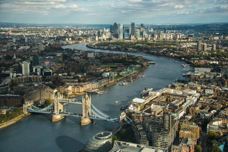 Aerial view of Tower Bridge and the River Thames with the Canary Wharf skyline in London