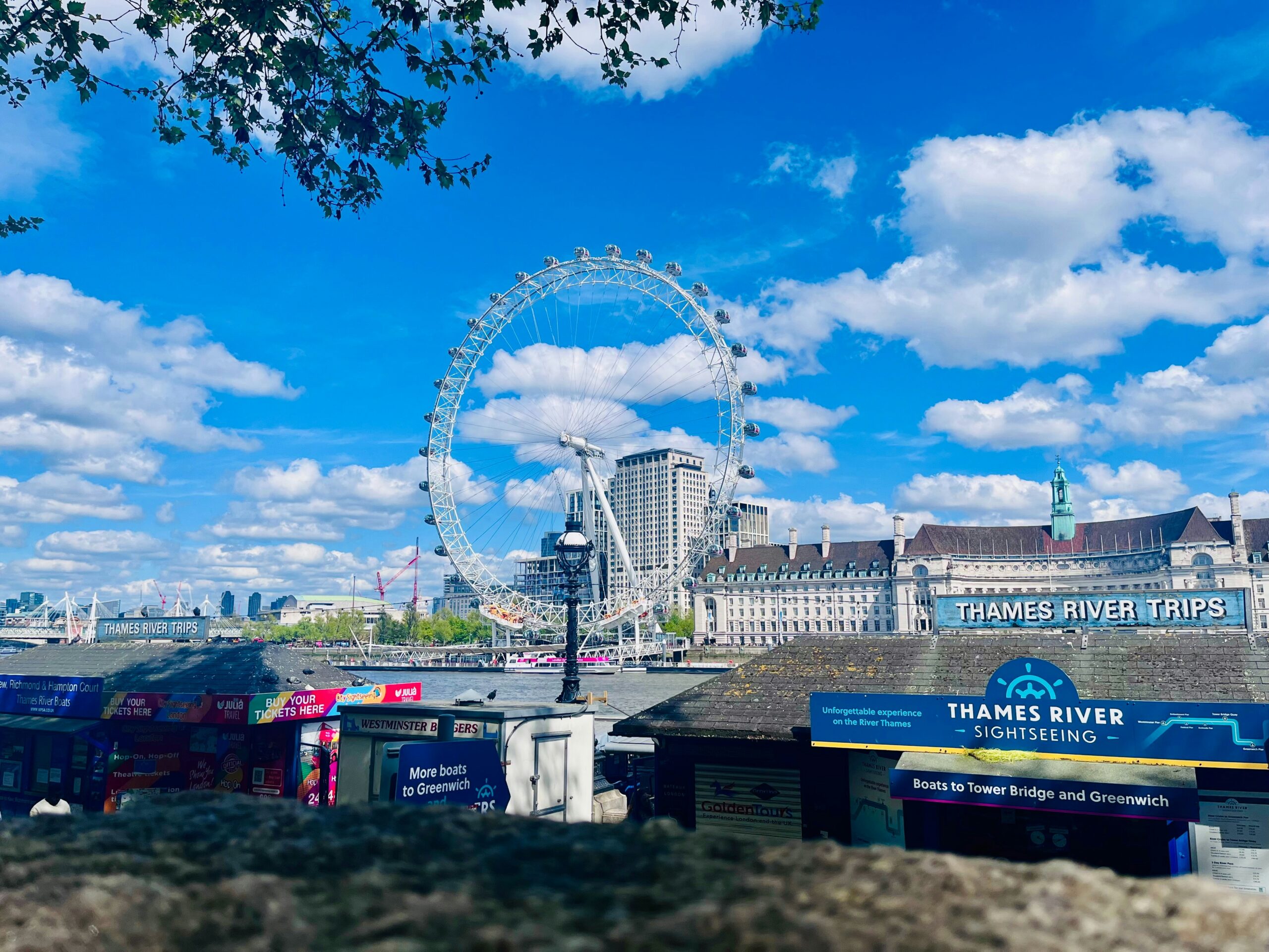 London Eye viewed from Westminster Pier beside Thames River Sightseeing on the River Thames in London