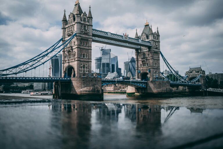 Thames River Sightseeing Blog 2 Tower Bridge London landmark with River Thames and city skyline under overcast sky