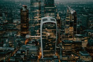 Illuminated City of London skyline at night as seen from The Shard