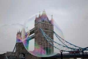 Large soap bubble framing Tower Bridge in London