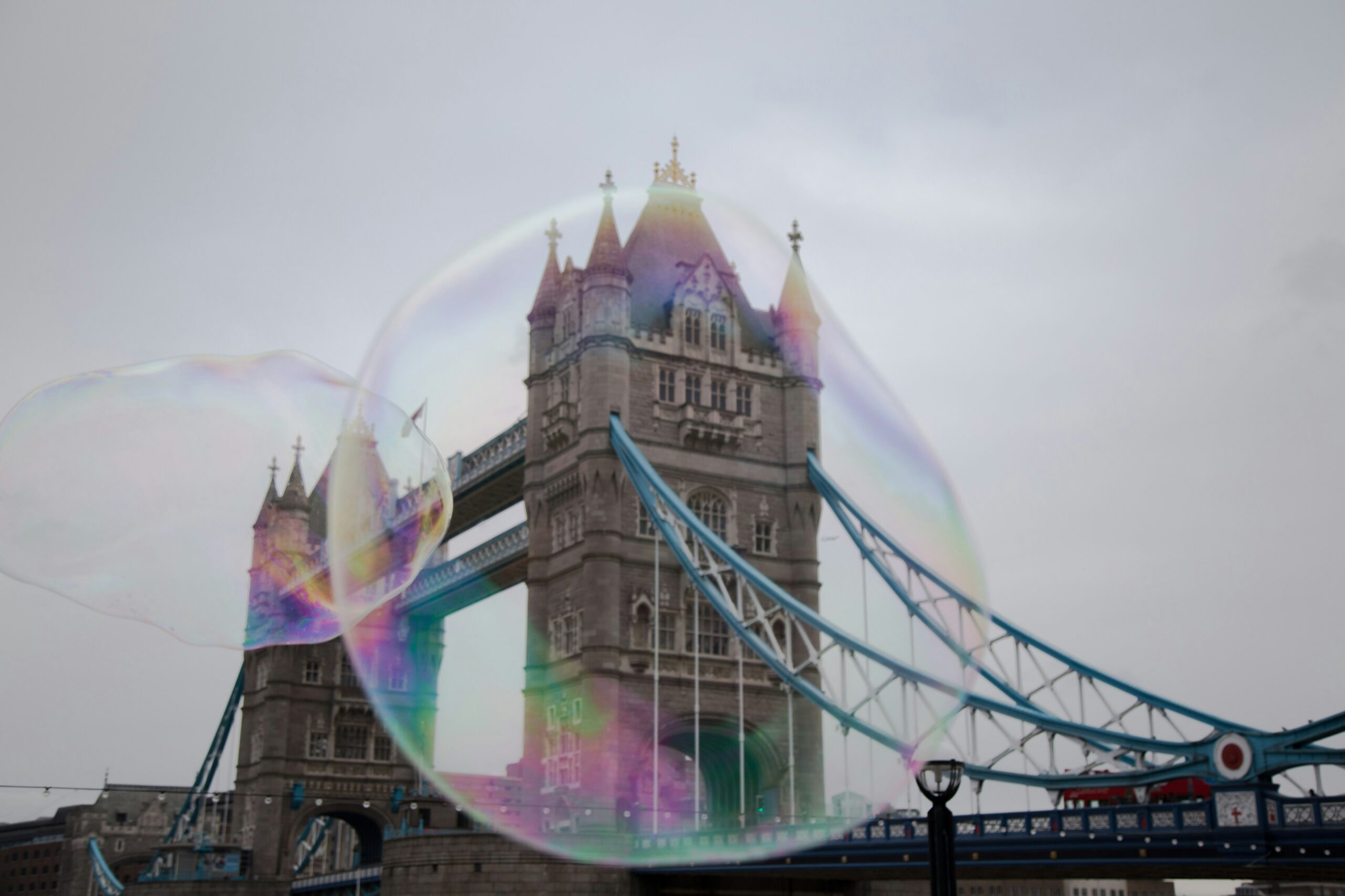 Large soap bubble framing Tower Bridge in London